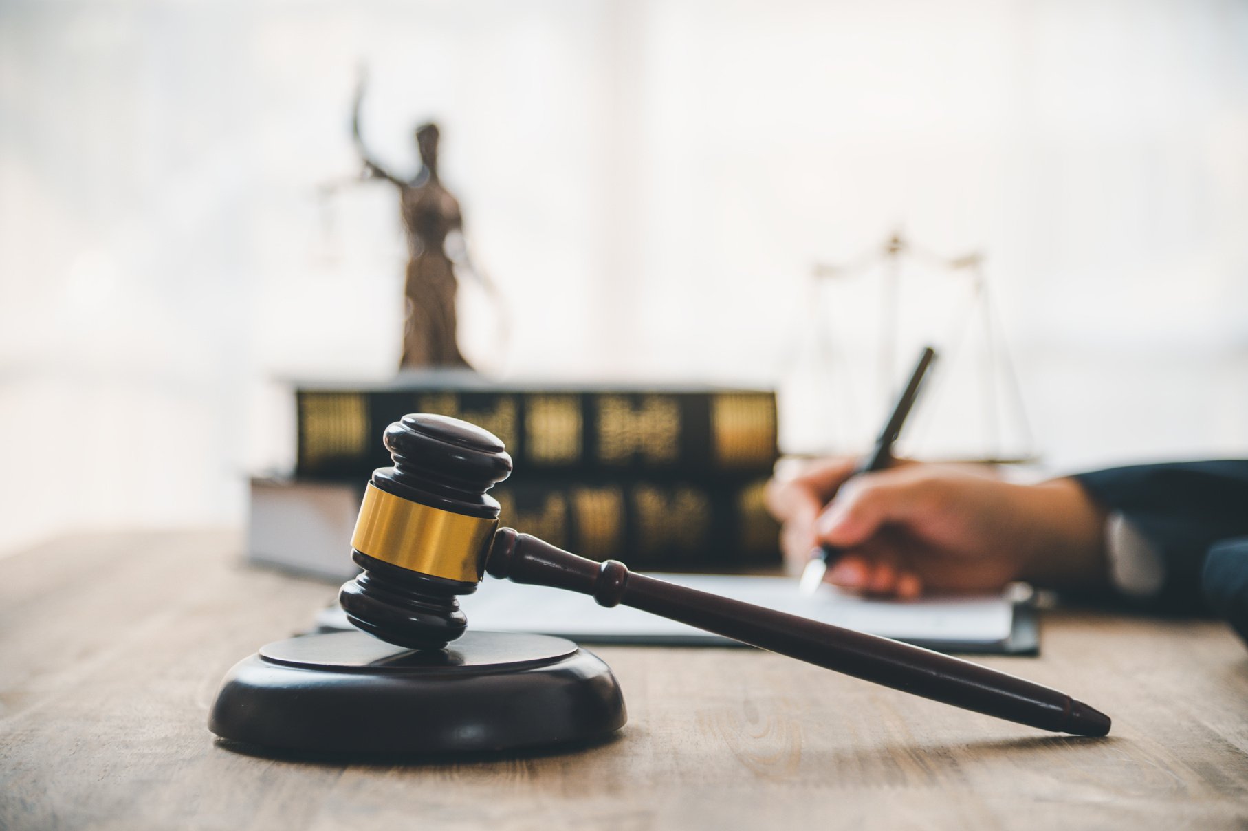 Law theme, mallet of the judge, law enforcement officers, evidence-based cases and documents taken into account.